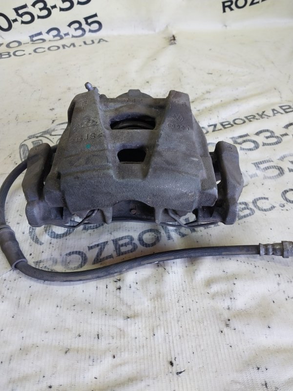 Суппорт тормозной передний правый passat 2014 B7 2.0